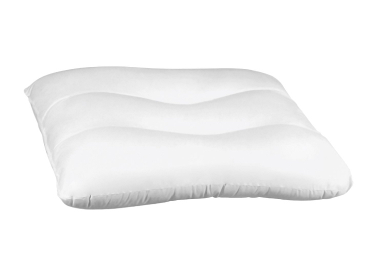 Oreiller blanc sur fond blanc.